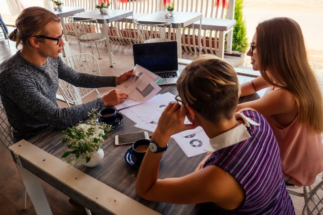 group-of-three-people-working